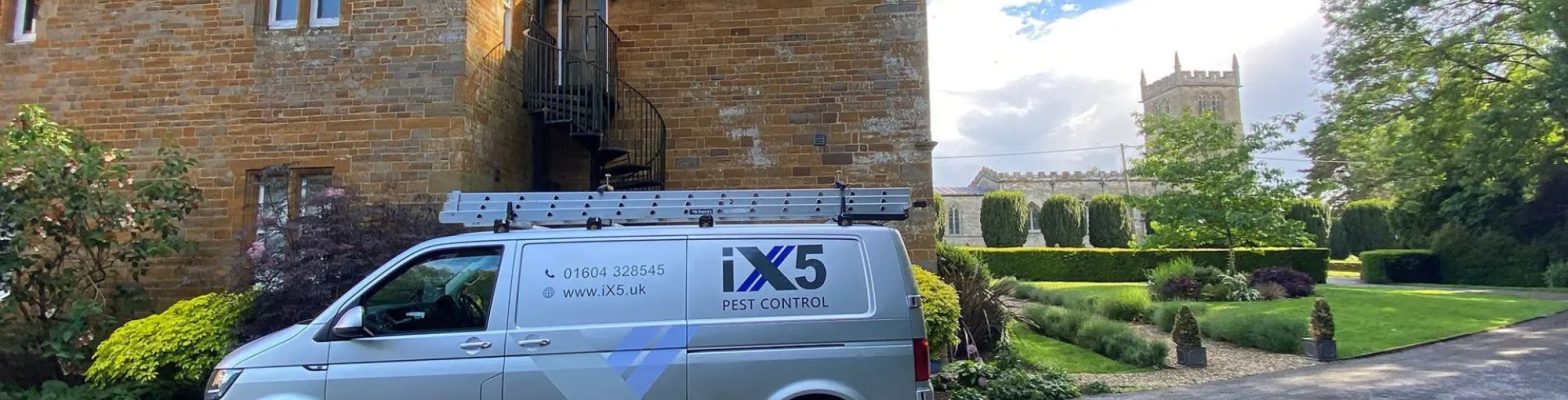 iX5 Pest Control van parked beside a historic building in Northamptonshire, representing a growing business in need of accounting support for pest control companies